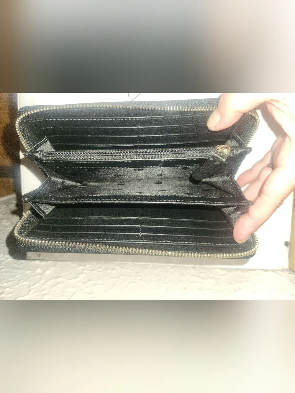 kate spade Black Pebbled Leather Zip Wallet with Embossed Logo